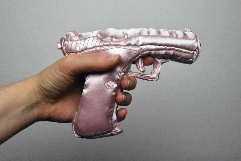 Hand-sewn replica of the P7 gun by Heckler&Koch, scale 1:1, made out of satin, filled with sesame seeds and dried lavender. Photo print on aluminium, 60x40cm. 2017