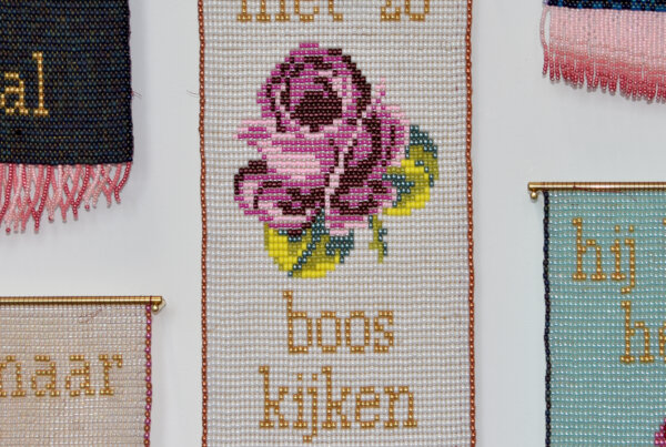 This work is part of a series where I am going to integrate common replies in Dutch on sexist or other inappropriate behaviour into kitsch tapestries, with an embroidery-style rose in the middle. I started working on these tapestries during the large #metoo scandal on The Voice of Holland.